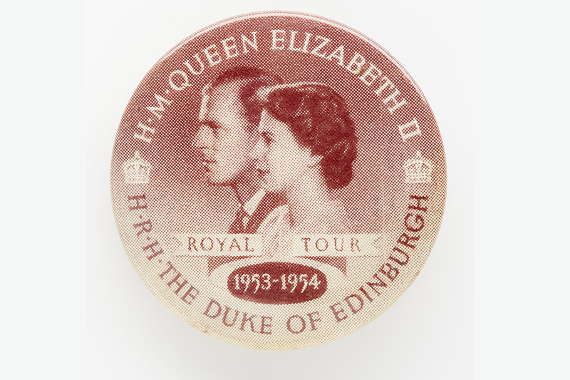A red and cream badge of profile photos of Queen Elizabeth II and the Duke of Edinburgh