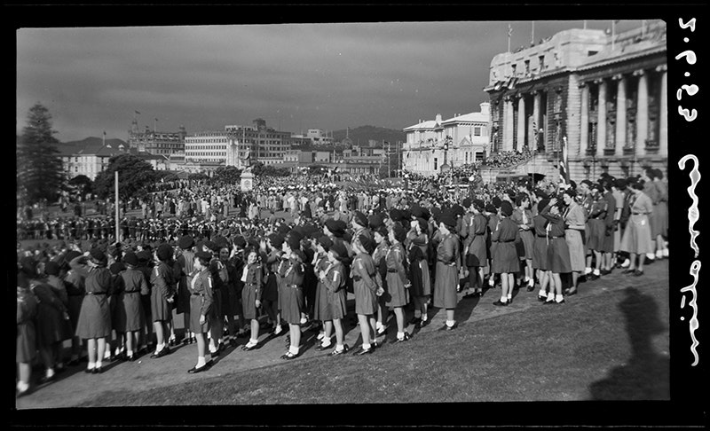 A lot of people including Girl Guides stand in front of Parliament Buildings in Wellington