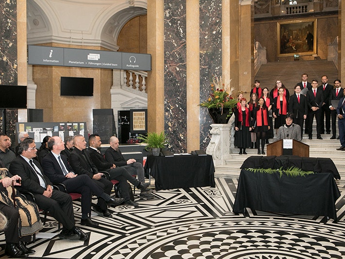 Natural History Museum, Vienna. Photo: Katharina Fröschl-Roßboth A group of people on a set of steps in a room with other people