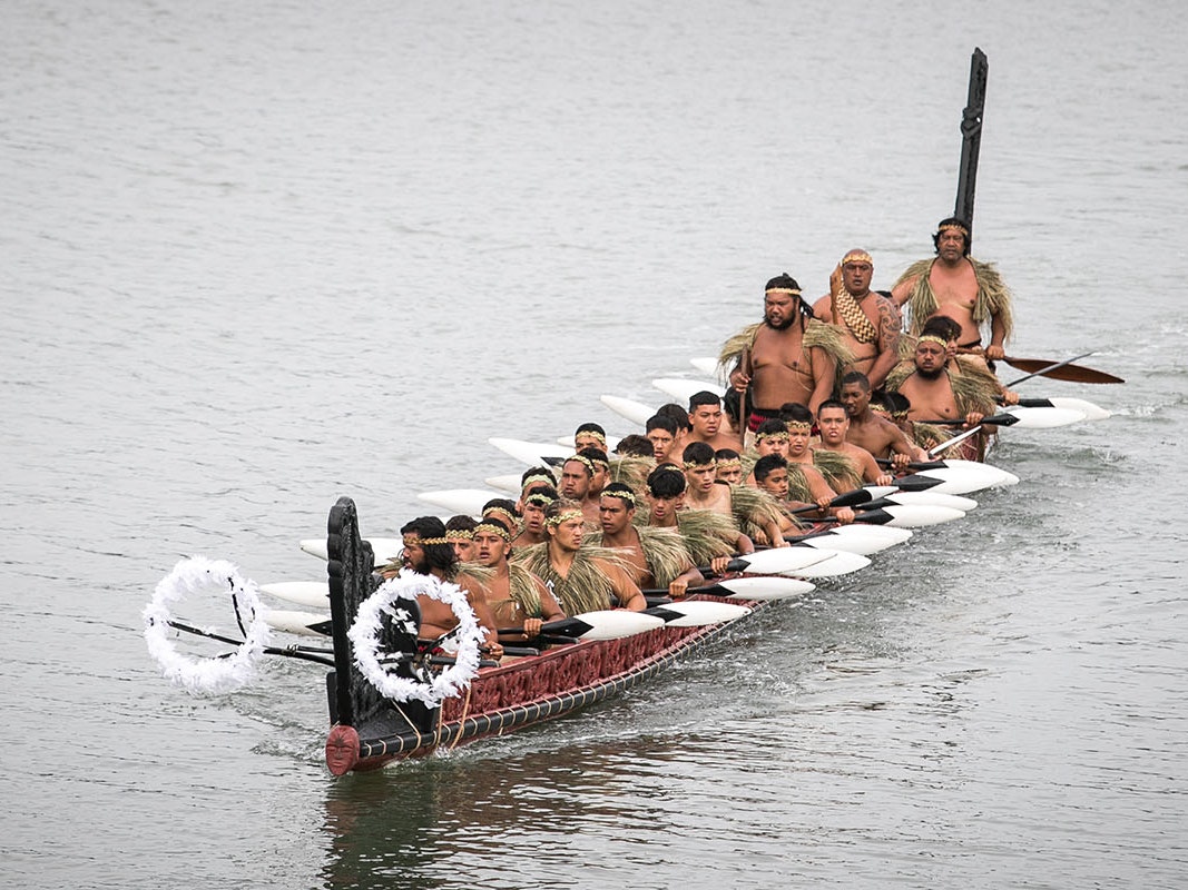 Waka taua at Waitangi, 2020. Photo courtesy of Te Rawhitiroa Bosch Photo of a group of men in a waka in a body of water