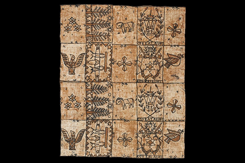 A paper cloth with designs on it. It's sepia and brown in colour
