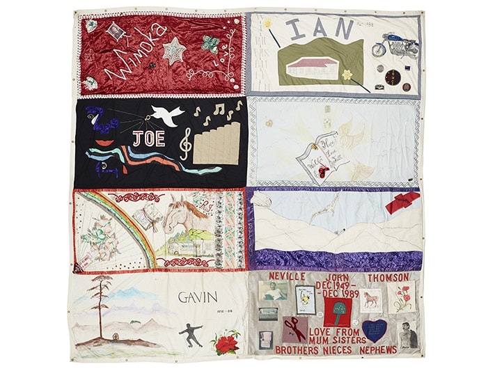 ma_i281801_tile.jpg A patchwork quilt section with names and words on it in honour of people who have died from AIDS