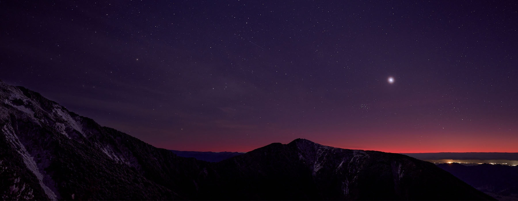 View of the Matariki star cluster at sunrise in a dark night sky