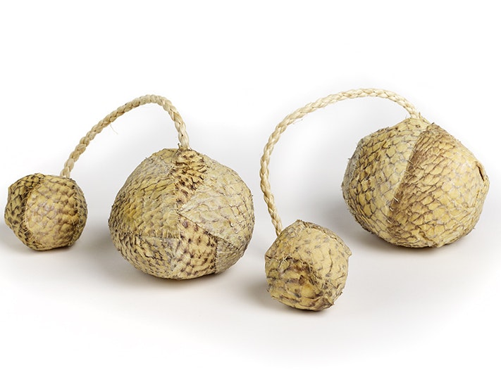 ma_i768861_copy.jpg Two balls made of fish skin each with a cord for hanging on to.