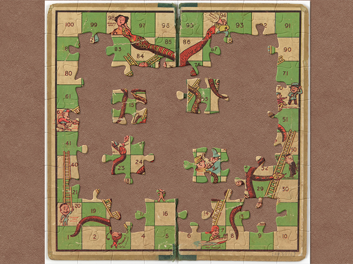 Board Game, Snakes and Ladders(link is external), 1930s-50s. Gift of the Guard family, 1991. Te Papa (GH003816) jigsaw tile snakes and ladder board with pieces missing