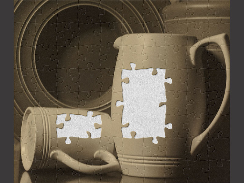 Photo of a collection of crockery, including a plate, jug, and cups