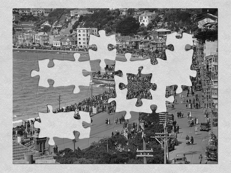 Oriental Bay, Wellington, 1920-1935, New Zealand, maker unknown. Purchased 1999 with New Zealand Lottery Grants Board funds. Te Papa (A.030543) View of Oriental Bay, with Wellington Harbour on the left and houses lining the street on the right. A crowd of hundreds is walking along the boardwalk