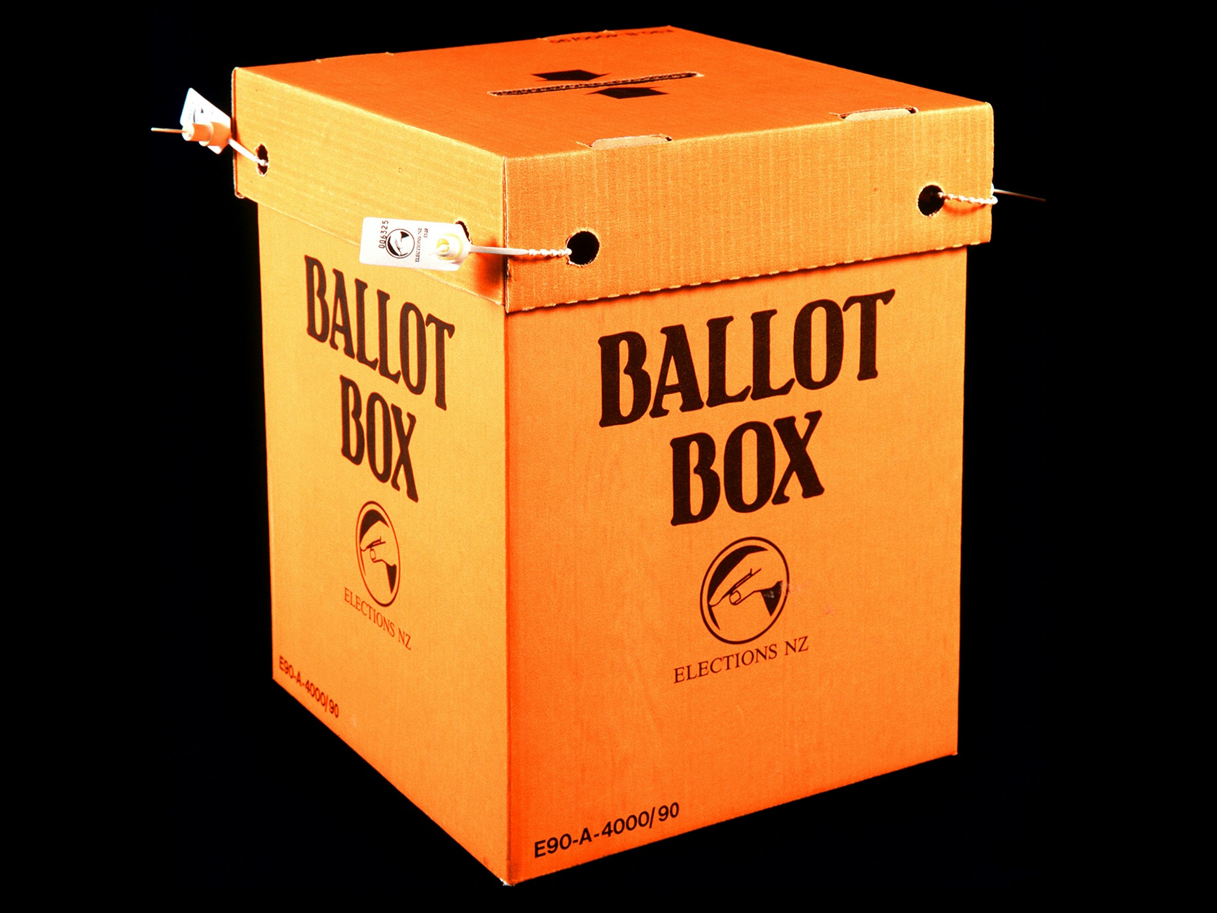 Ballot Box, New Zealand Government; 1993, Cardboard and plastic. Gift of the Electoral Commission. Te Papa (GH004193) An orange cardboard box with Ballot Box written on the side
