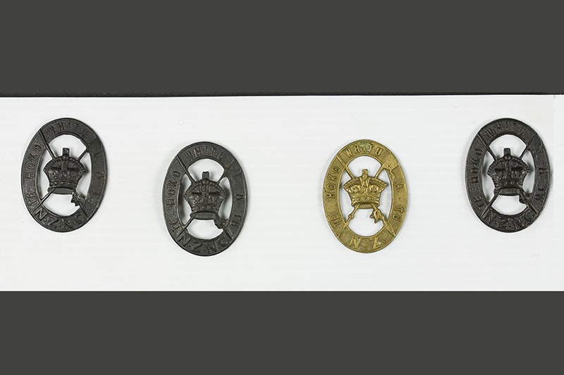 Four medals on a polystyrene background.