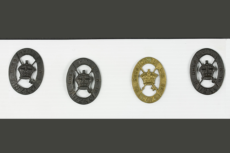 Four medals on a polystyrene background.