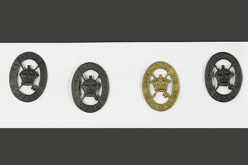 Four medals on a polystyrene background.