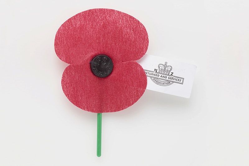 A red poppy made of plastic and fabric