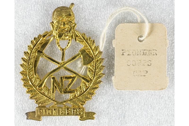 A gold battalion medal with a tag that says New Zealand Pioneer Battalion.
