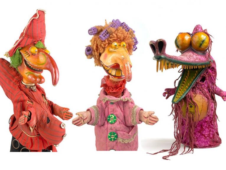 Three brightly coloured puppets on a white background.