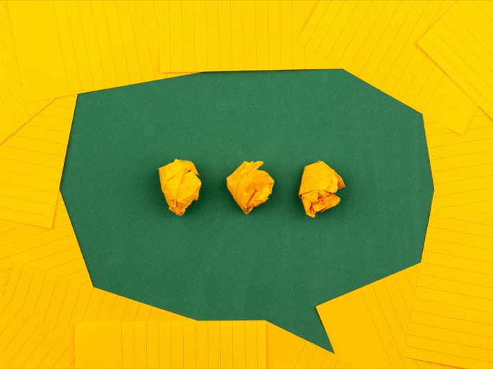 Volodymyr Hryshchenko, three crumpled yellow papers on green surface surrounded by yellow lined papers, 2019. Unsplash Three crumpled yellow papers on green surface surrounded by yellow lined papers suggesting a thinking bubble