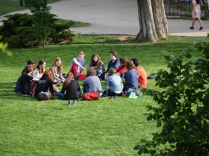 Group of friends in Prague, Czechia, 2021. Photo by Beth Macdonald / Unsplash Group of young people sitting in a circle in a park