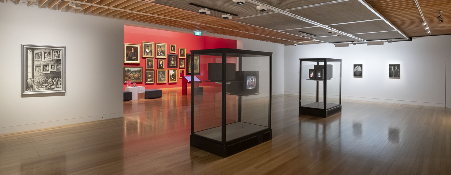 View of the exhibition ‘New Histories’, showing two display cases containing TV sets in them