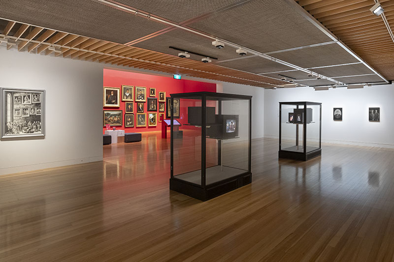 View of the exhibition ‘New Histories’, showing two display cases containing TV sets in them