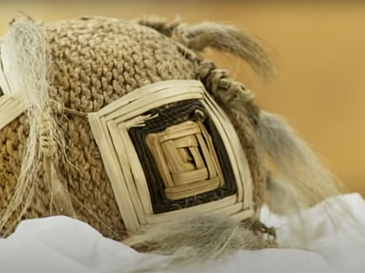 Still from Tales from Te Papa Poi Awe. Te Papa Close up on a woven ball with tassels