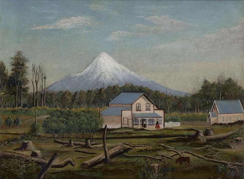 View of two buildings, a homestead and a church, surrounded by felled trees. Behind them a dense forest, and behind that forest stands Mt Taranaki, dominating the distant view