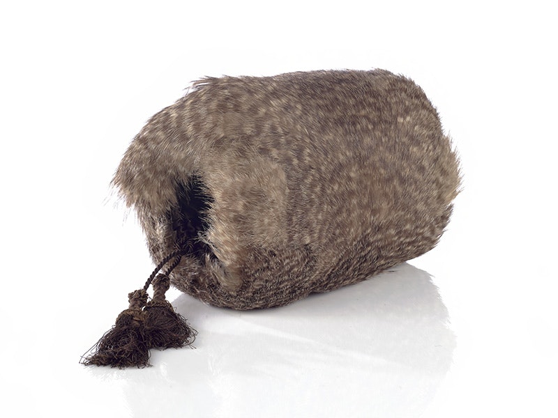 Muff, kiwi feather, 1870s, New Zealand, maker unknown. Bequest of Marjorie Hector, 1948. CC BY-NC-ND 4.0. Te Papa (PC000107) A round shape made of feathers - hands can be put in each end to keep warm