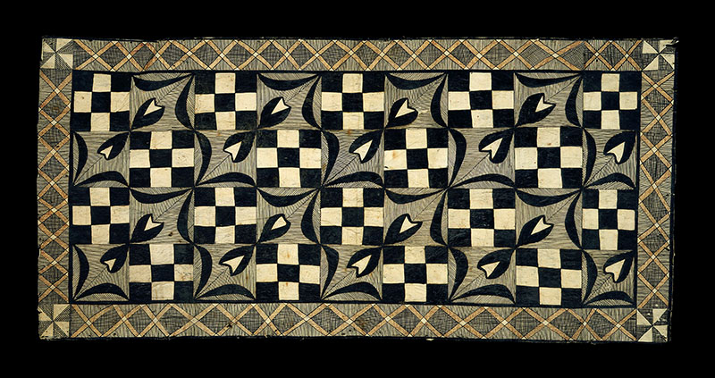 Tapa cloth. The border is a network of orange Xs, while the internal patterns alternate between checkerboards and flowers
