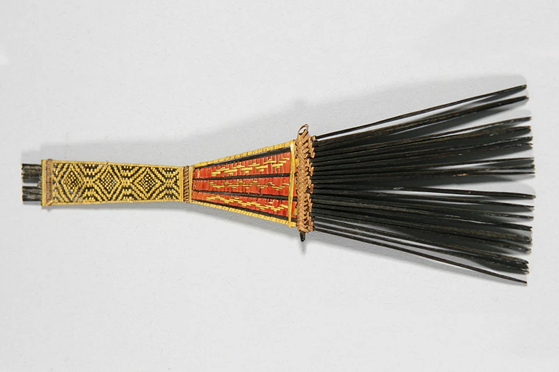 A hair comb with a braided handle.