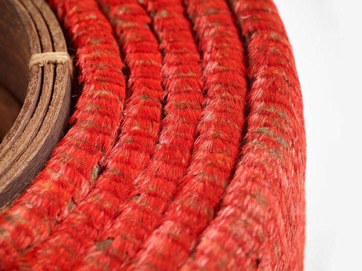Tevau (red feather currency), feathers, 1900s; Santa Cruz Islands. Purchased 2012. Te Papa (FE012737) A coiled belt made of hundreds of small red feathers and leather in the middle.