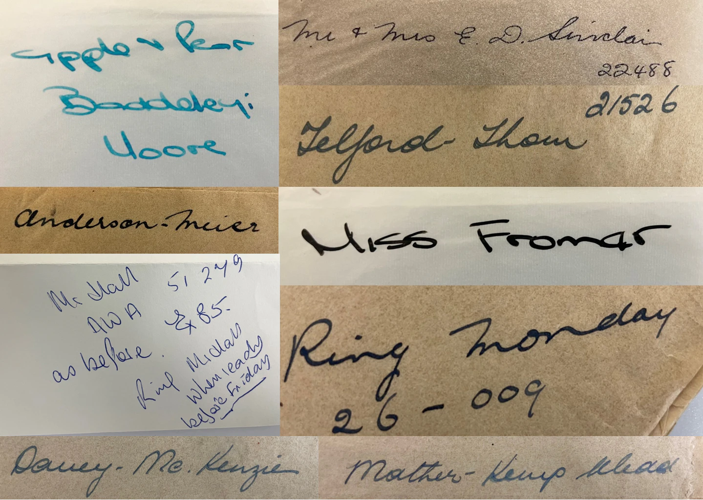 several wax-paper envelopes with handwriting on them are arranged in a group