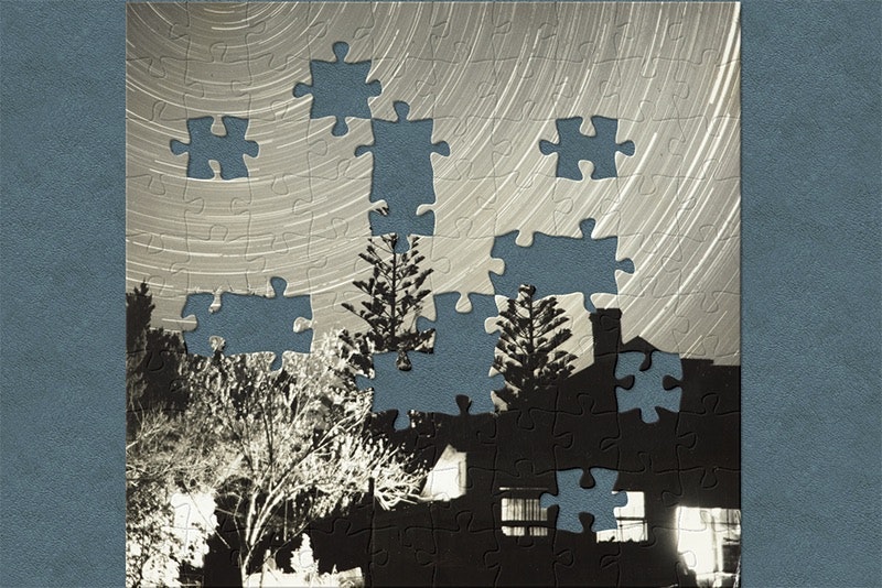 An image of a photograph that has jigsaw piece shapes cut out of it.