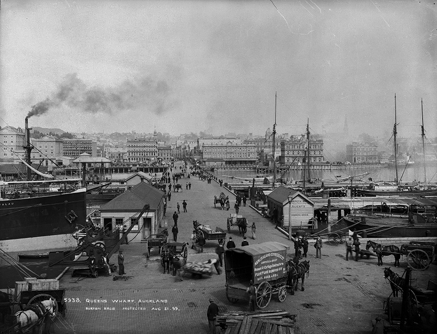A black and white photo of an industrial active port in a city in the late 1800s.