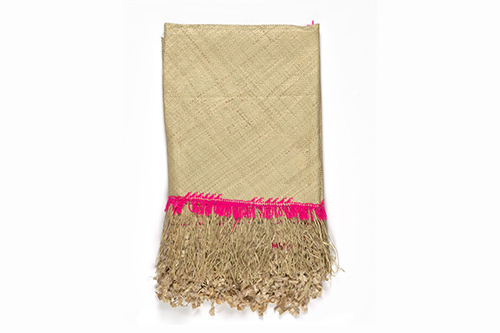 White mat made from pandanus with a pink trim