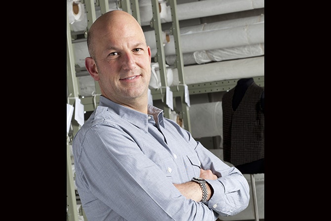Head and shoulders of a man smiling at the camera