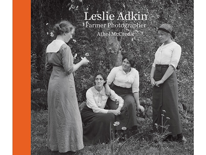 Leslie Adkin Farmer Photographer book cover A book cover with a black and white photo of four women by a tree and the words Leslie Adkin Farmer Photographer and Athol McCredie.