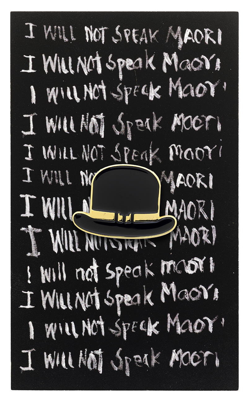 A black card with lines of white writing on it that says 