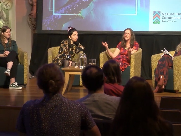 Lauren Vinnell, Catalina Miranda, and Julia Becker at Te Papa Four women are sitting on a stage and talking to an audience