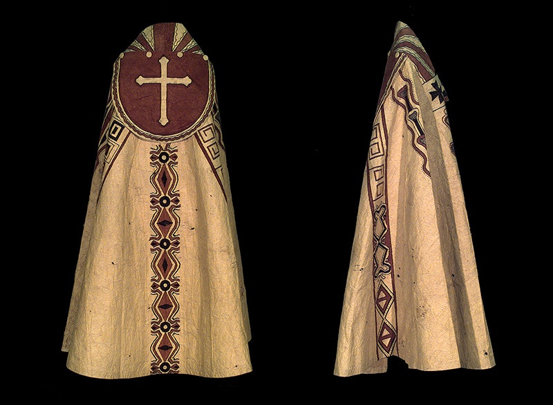 Two views of a tapa cape with one view showing a Christian cross on the shoulders.