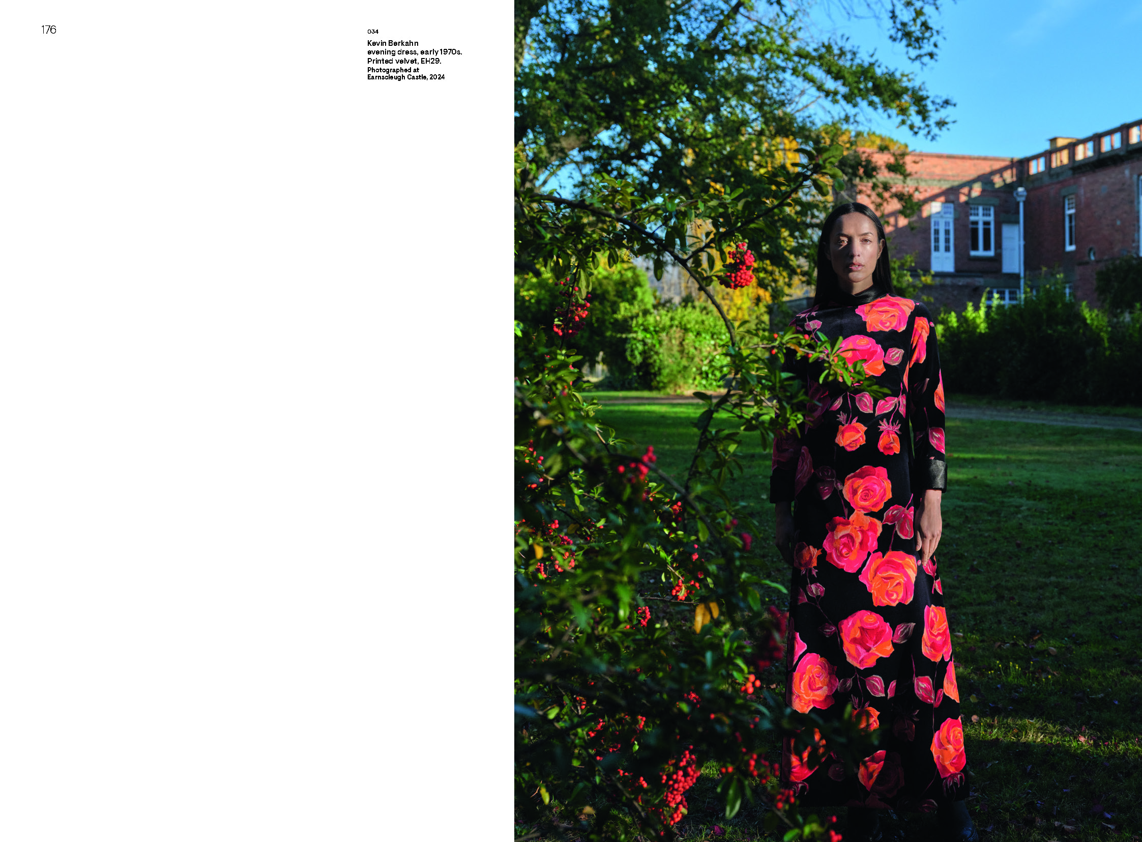 A page from a book with some text and a photo of a woman standing in a garden wearing a longsleeved, long dress that is black with large red and orange roses.
