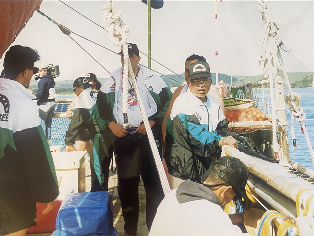 A photo of several crew members on a boat.
