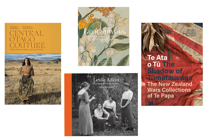 Four book covers on a white surface