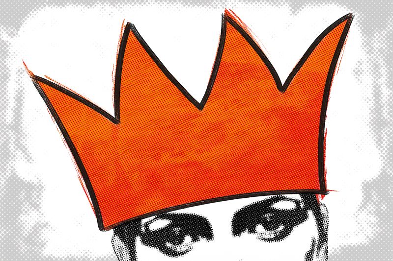 A graphic of a large orange crown or party hat on someone's head. You can see heavily made-up eyes and ears of the head.