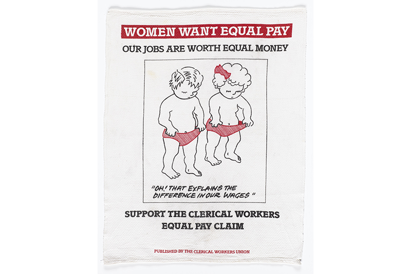 A teatowel showing two small children holding their pants open and looking down. The main message is "Oh! That explains the difference in our wages"