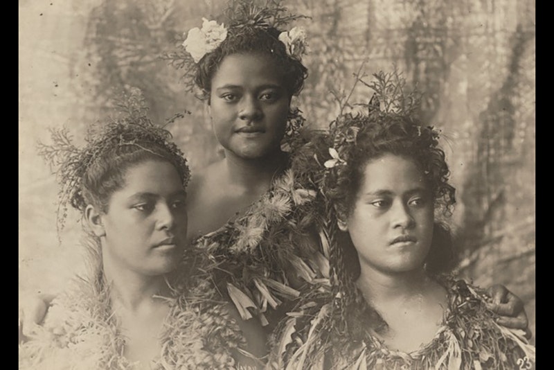Sepia photo of three Pacific women in a photographic studio.