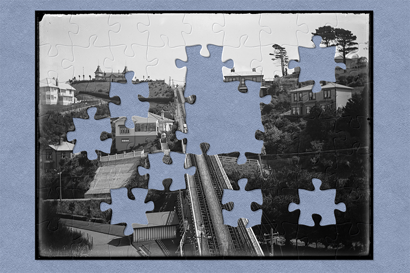 Black and white photo with jigsaw-shaped pieces missing.