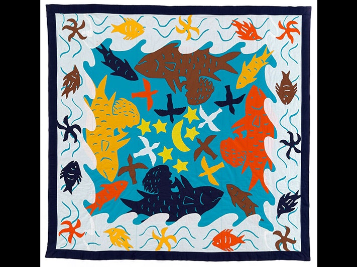 Tīvaevae 'Ina and the shark' (embroidered quilt), various makers, about 1990; Aitutaki Atoll. Purchased 1992 with New Zealand Lottery Grants Board funds Te Papa ( FE010090) A patchwork quilt with stylised fish, stars, moon, waves, and seaweed images.