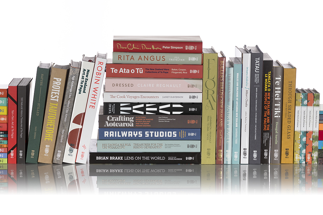 A stack of books both sitting horizontally and vertically.
