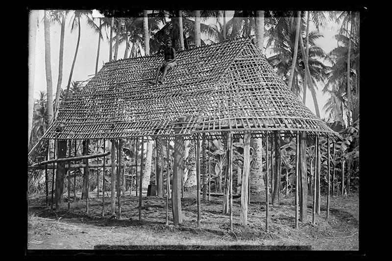 A house build on an island in the Pacific that is mae from trees and has no walls.