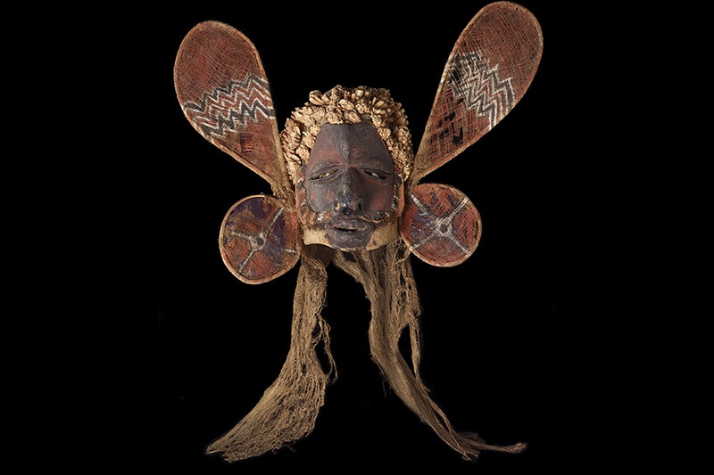 A mask that has round wings or loops with thread crisscrossed over them.