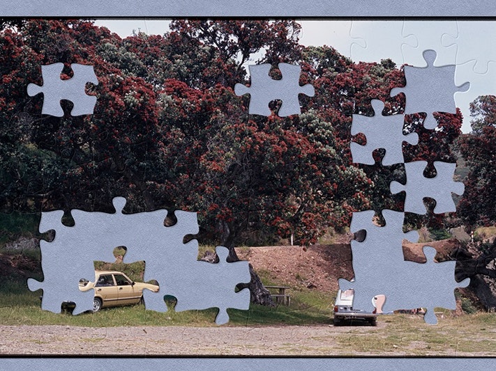 Camping site beneath Pohutukawa trees in the countryside, Eric Lee-Johnson; 1980s; New Zealand. Purchased 1997 with New Zealand Lottery Grants Board funds. Te Papa (CT.013933) Two cars are parked under some large trees that have red flowers on them. Next to each car is a camping tent. There is someone sitting in front of one of the tents in a fold-out chair. The image has jigsaw piece shapes missing.