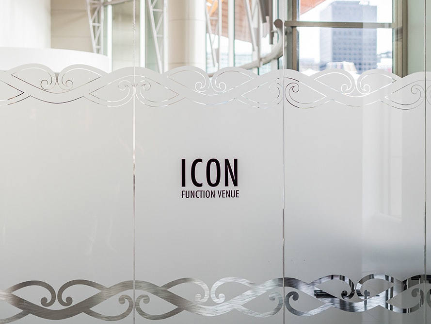 Te Papa Venues, 2024. Photo by The Way Home. Te Papa (267212) An image of a glass door with frosted window and the words Icon Function Venue etched into it.